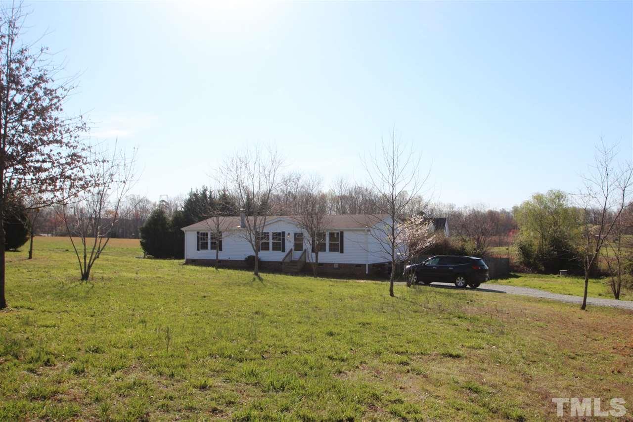 1336 Pixley Pritchard Road Timberlake, NC 27583 - Photo 1 of 4 a view of a house with a yard