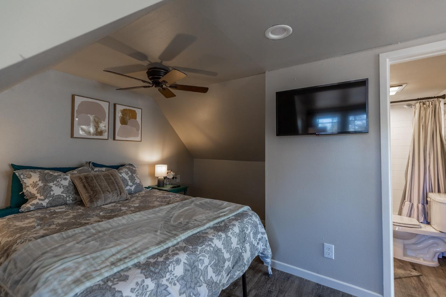 2124 Broadway Street Lubbock, TX 79401 - Photo 11 of 14 a bedroom with a bed and a flat screen tv
