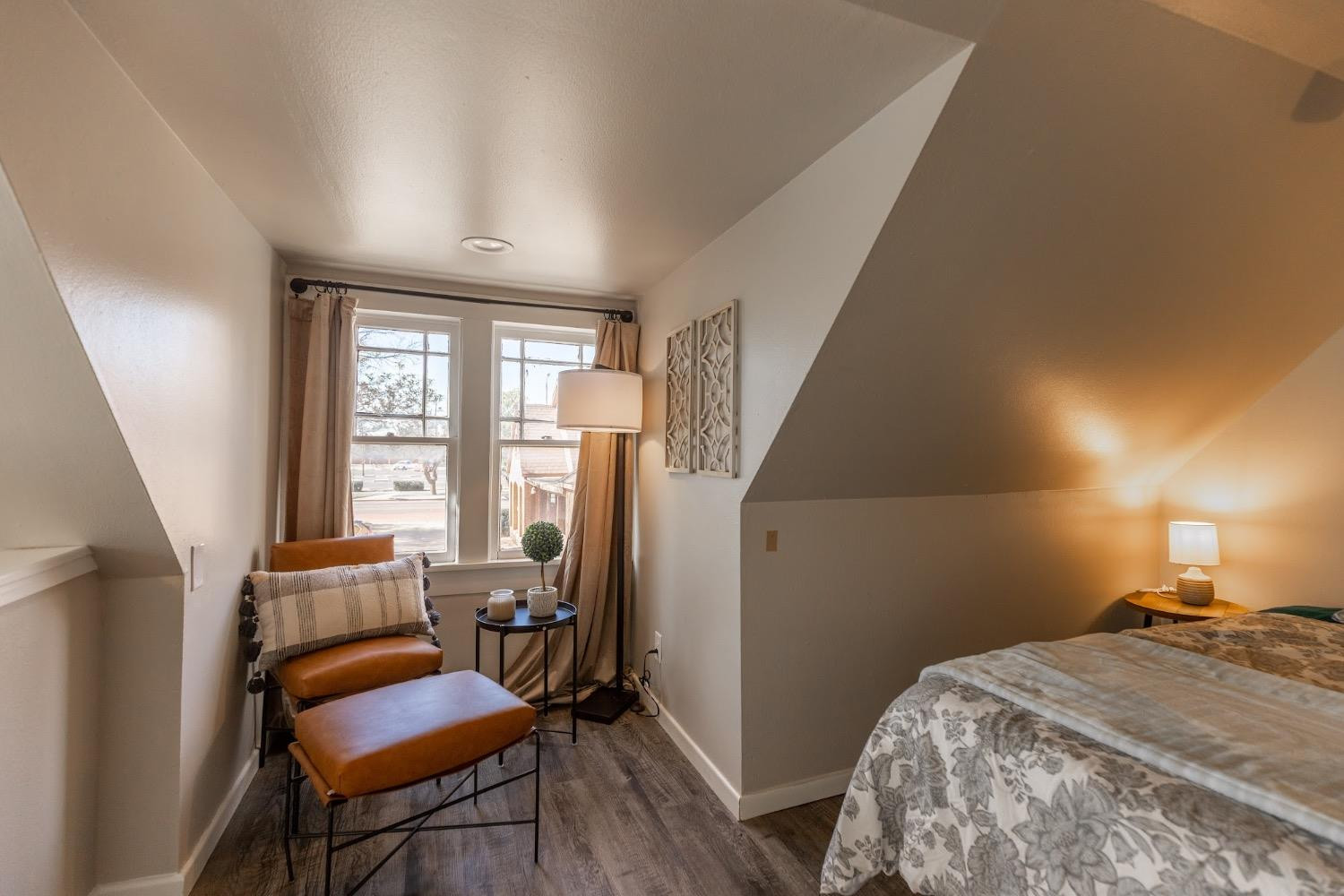 2124 Broadway Street Lubbock, TX 79401 - Photo 12 of 14 a bedroom with a bed and a chair