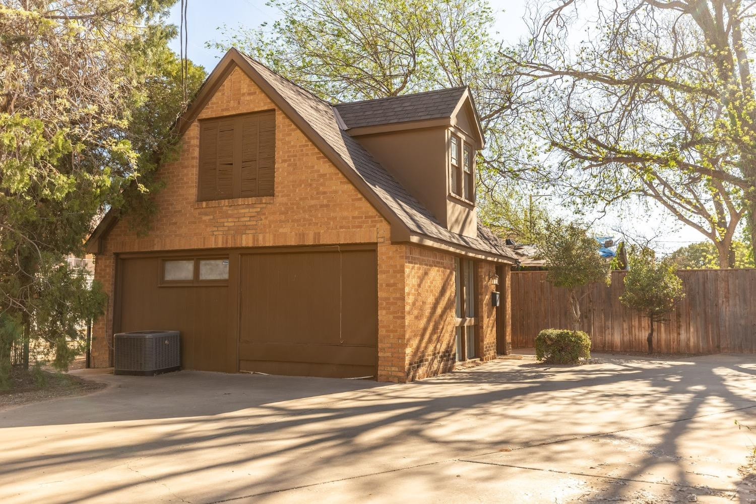 2124 Broadway Street Lubbock, TX 79401 - Photo 2 of 14 a view of a house with a yard and garage