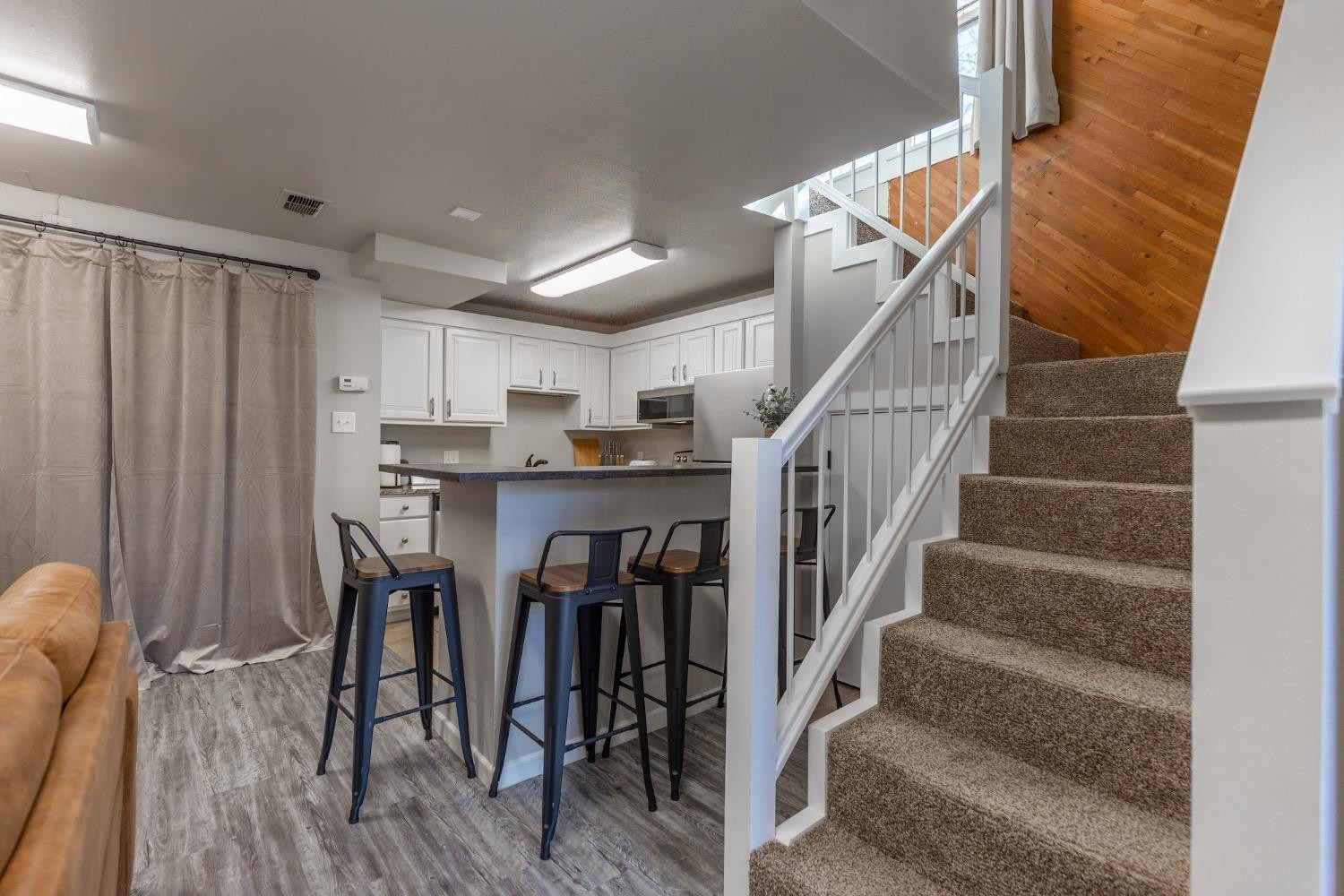 2124 Broadway Street Lubbock, TX 79401 - Photo 8 of 14 a view of entryway and kitchen with wooden floor