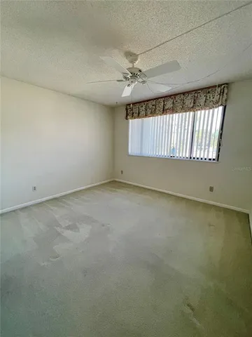 a view of bathroom with a toilet sink and mirror