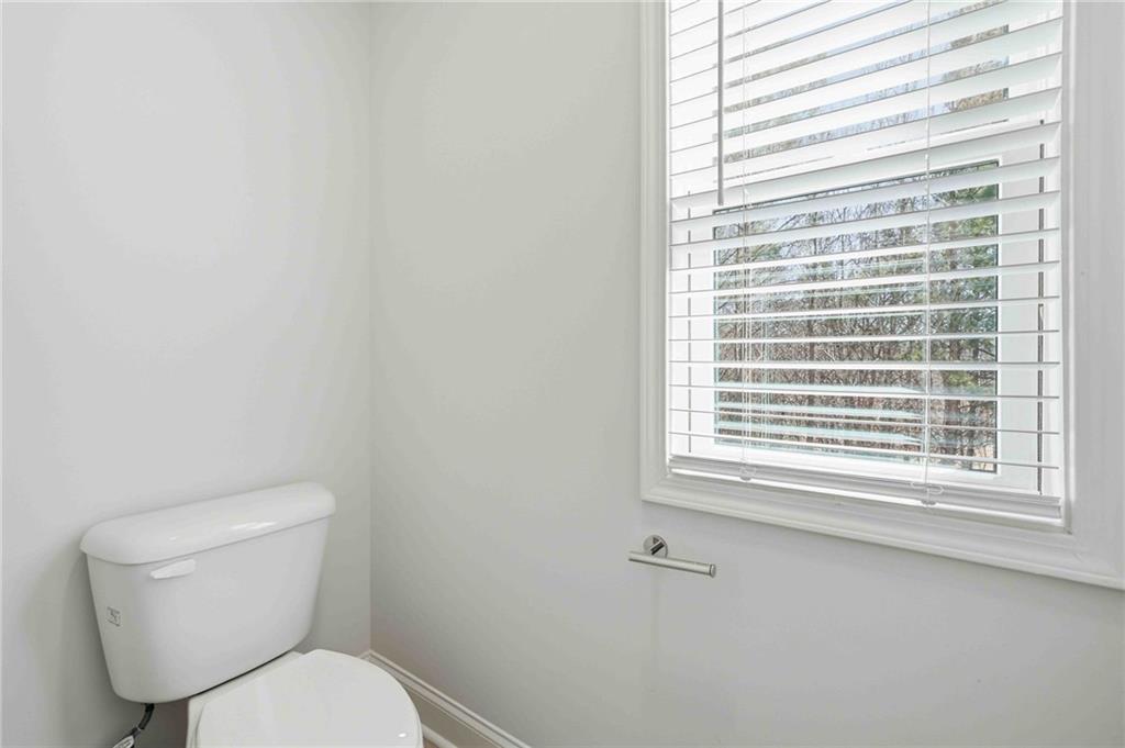 3302 Monarch Avenue Duluth, GA 30096 - Photo 33 of 83 a white toilet sitting next to a window