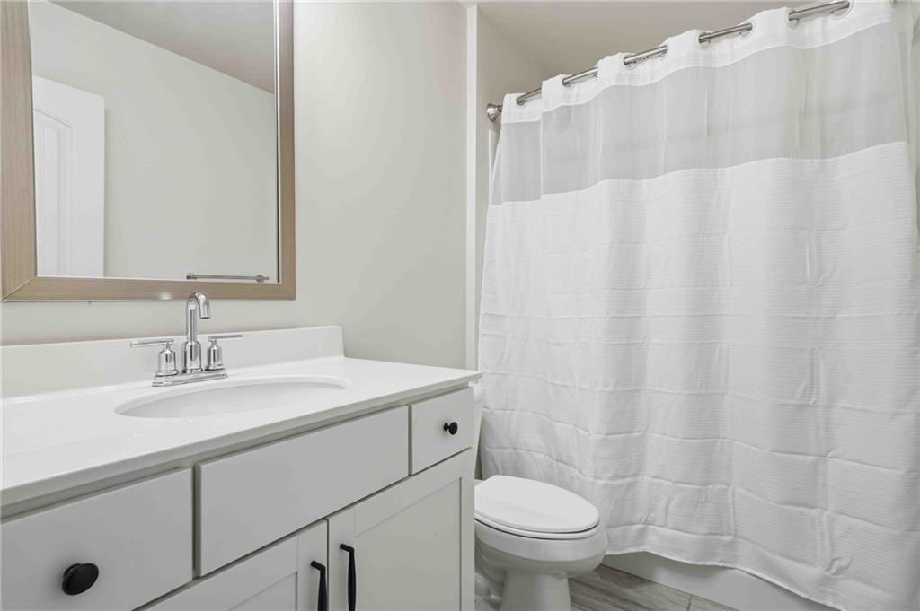 3302 Monarch Avenue Duluth, GA 30096 - Photo 36 of 83 a bathroom with a sink toilet and shower