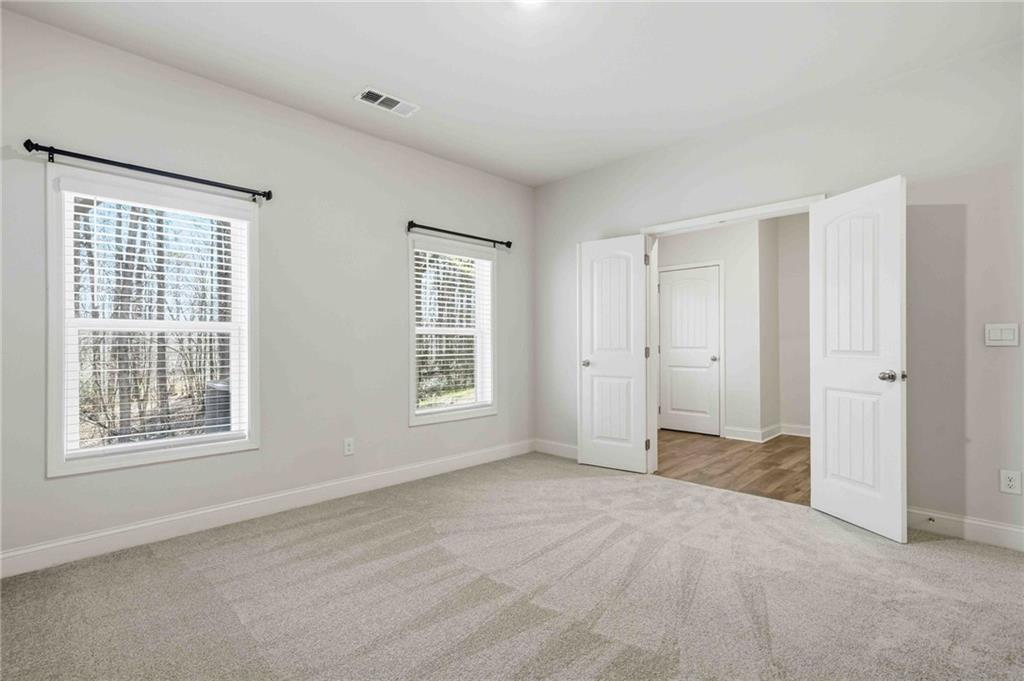 3302 Monarch Avenue Duluth, GA 30096 - Photo 50 of 83 a view of an empty room with a window