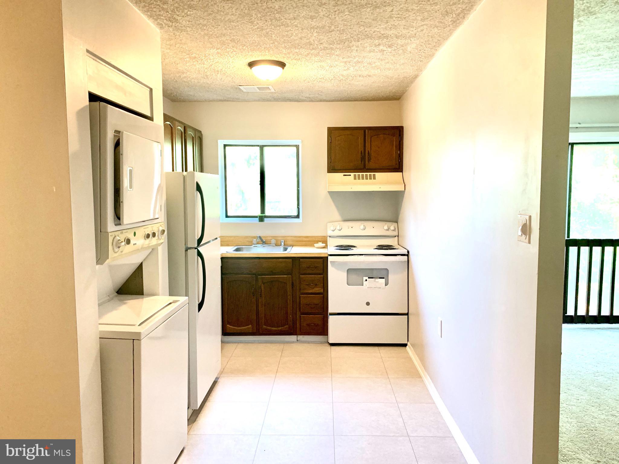 3926 Rolling Rd., Unit 11D Baltimore, MD 21208 - Photo 12 of 22 New Electric Stove & Dishwasher in Kitchen