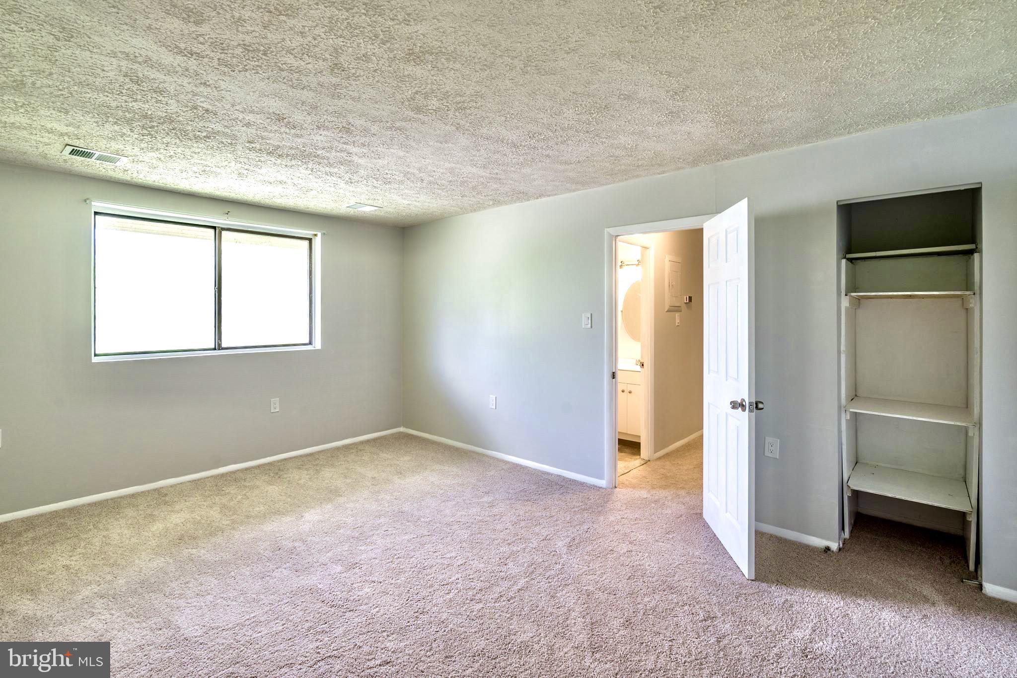 3926 Rolling Rd., Unit 11D Baltimore, MD 21208 - Photo 17 of 22 Spacious Bedroom with Shelving