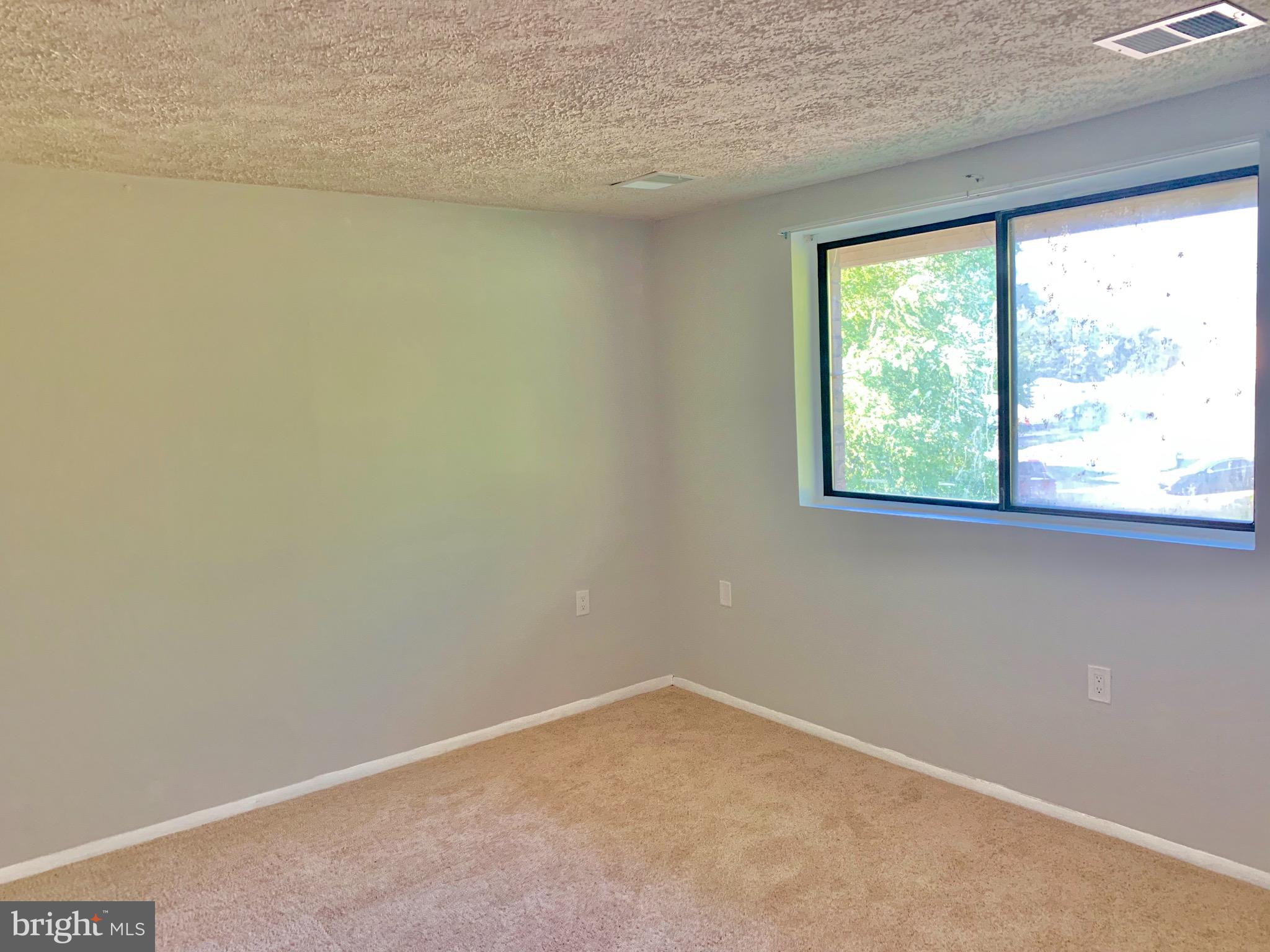 3926 Rolling Rd., Unit 11D Baltimore, MD 21208 - Photo 20 of 22 Lots of natural light in bedroom.