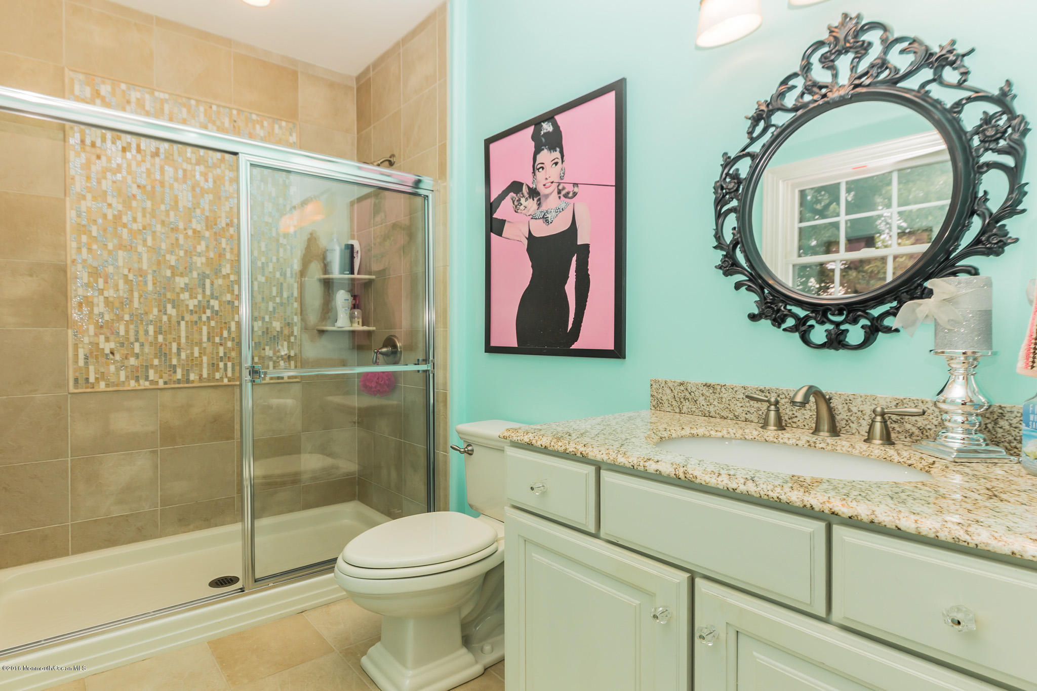 27 Thompson Grove Road Freehold, NJ 07728 - Photo 30 of 39 a bathroom with a toilet a sink and a mirror