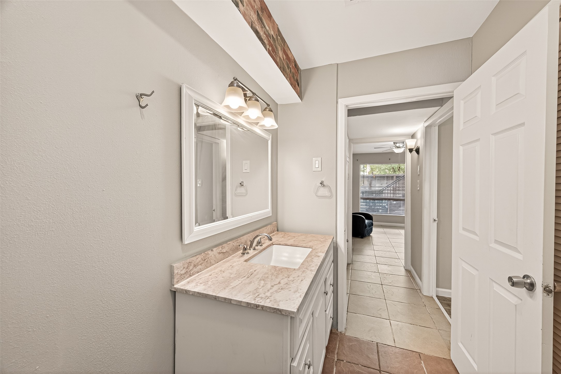 1529 Wirt Road, Unit 1 Houston, TX 77055 - Photo 10 of 16 a en suite bathroom with a granite countertop sink and a mirror