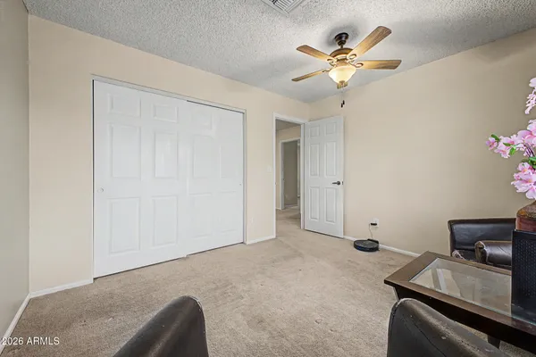 a very nice looking room with a ceiling fan