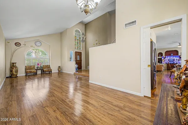 a view of a livingroom with furniture hardwood floor and staircase