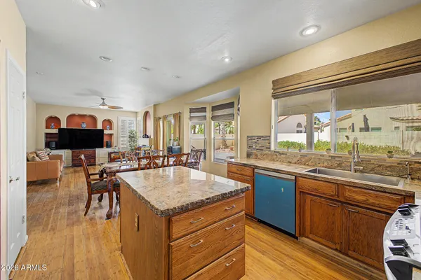 a kitchen with granite countertop lots of counter top space and dining table