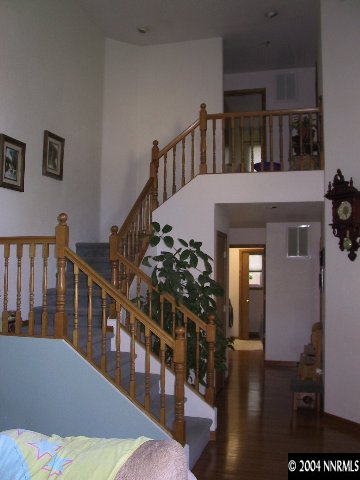 5741 Rivers Edge Drive, Unit 1 Fallon, NV 89406 - Photo 3 of 5 a view of entryway and hall with wooden floor