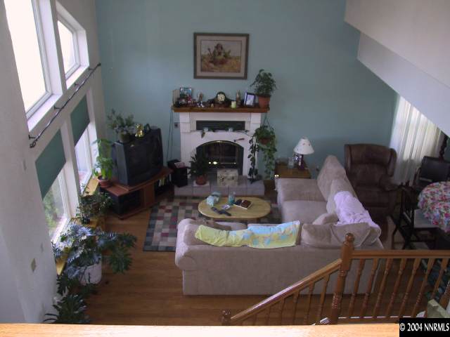 5741 Rivers Edge Drive, Unit 1 Fallon, NV 89406 - Photo 4 of 5 a living room with furniture and a fireplace