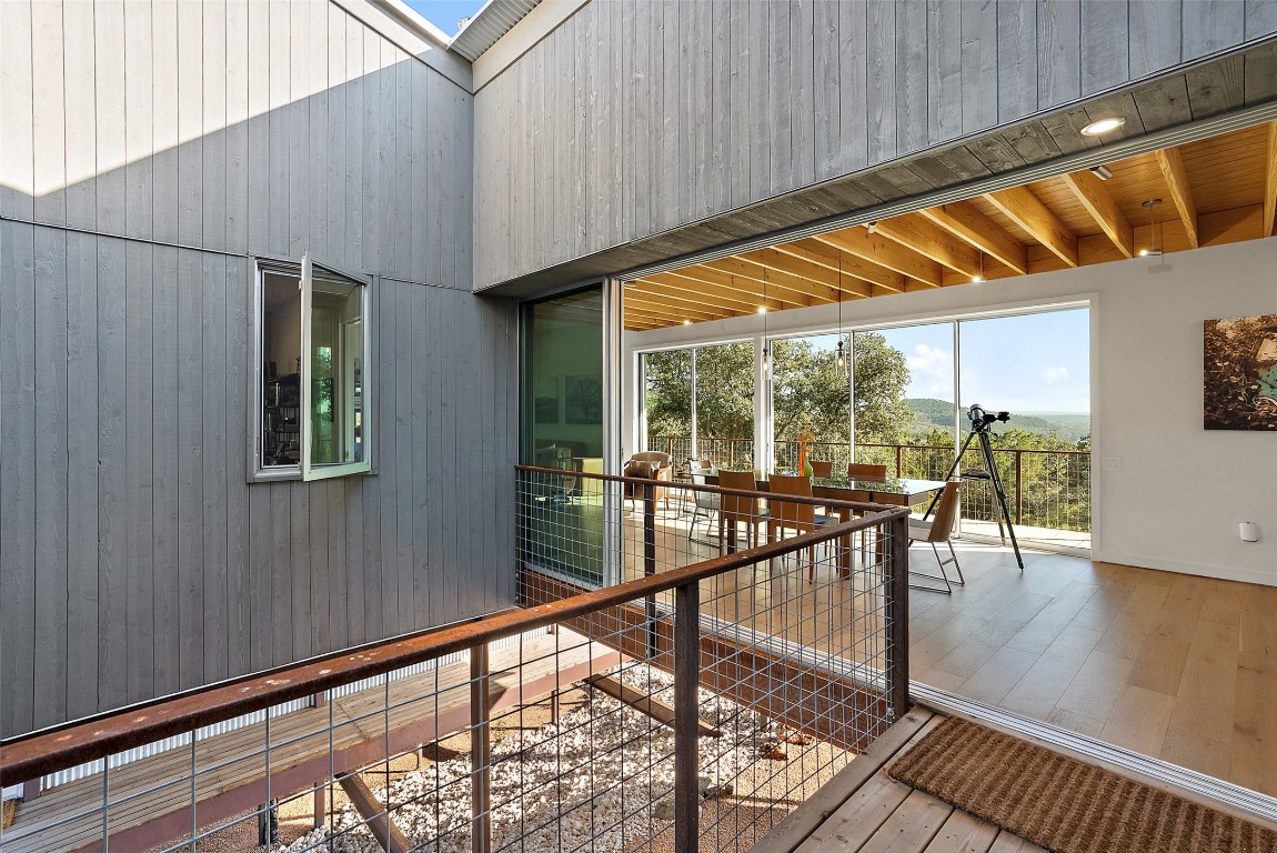 2037 Wolf Creek Ranch Road Burnet, TX 78611 - Photo 11 of 40 a view of a patio with a table and chairs