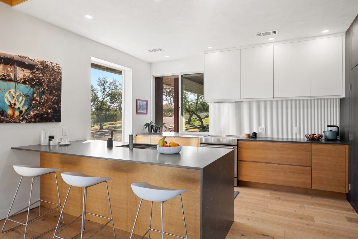 2037 Wolf Creek Ranch Road Burnet, TX 78611 - Photo 14 of 40 a kitchen with stainless steel appliances granite countertop a sink and cabinets