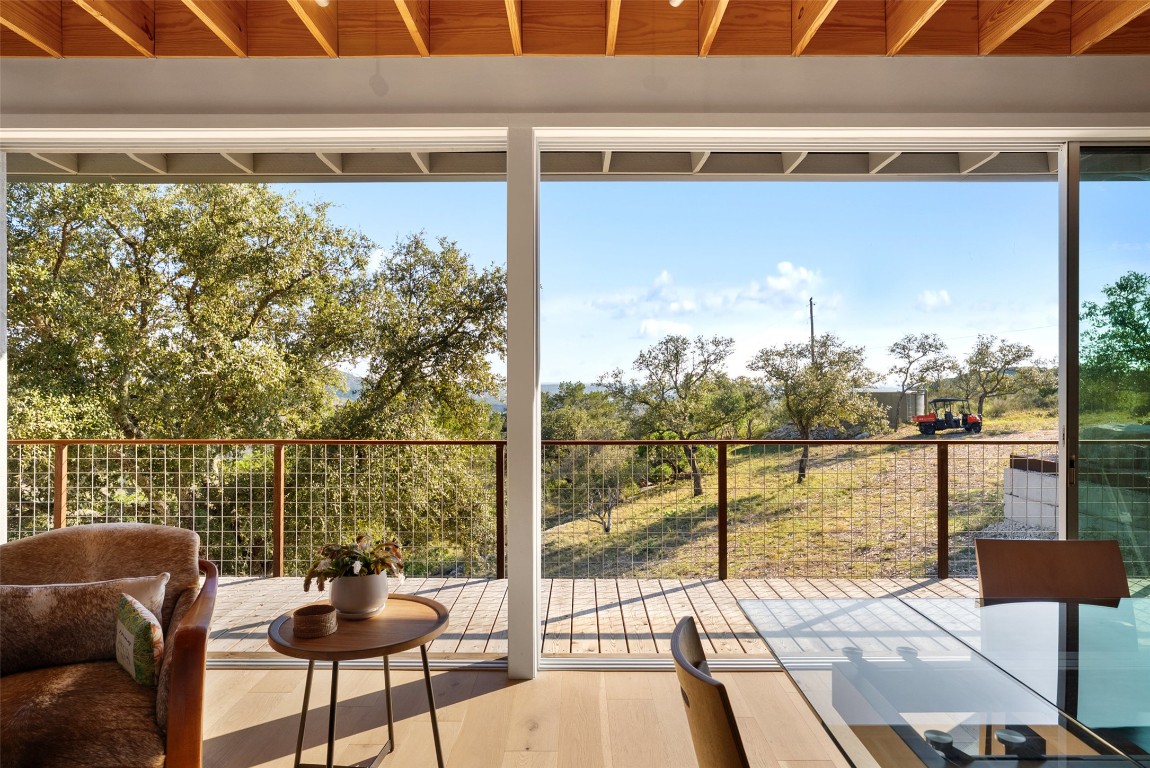 2037 Wolf Creek Ranch Road Burnet, TX 78611 - Photo 17 of 40 a balcony with table and chairs