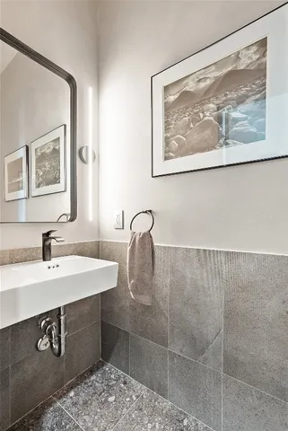 a bedroom with furniture and large windows