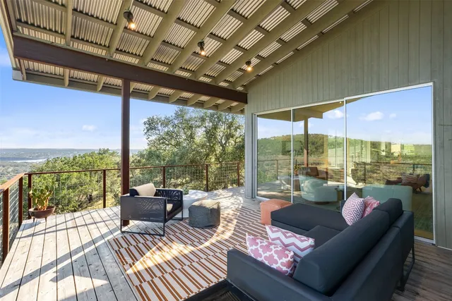 a view of a balcony with a ocean view