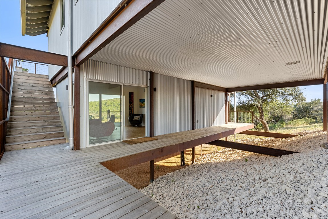 2037 Wolf Creek Ranch Road Burnet, TX 78611 - Photo 29 of 40 a room with wooden floor and furniture