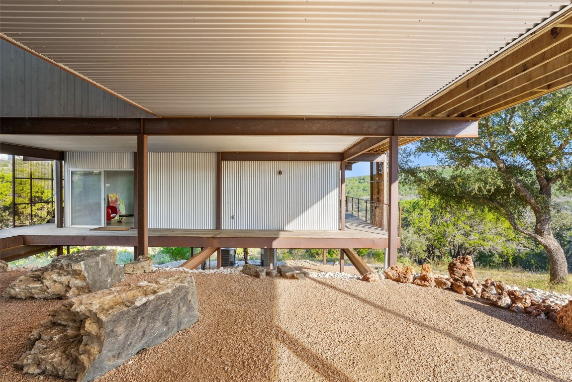 2037 Wolf Creek Ranch Road Burnet, TX 78611 - Photo 30 of 40 a front view of a building with garden