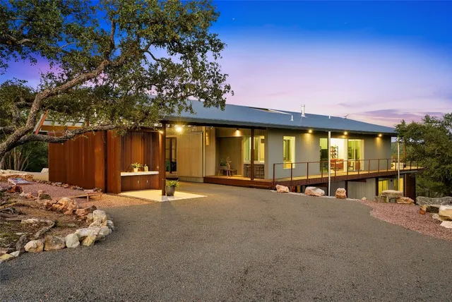 a swimming pool with outdoor seating and yard