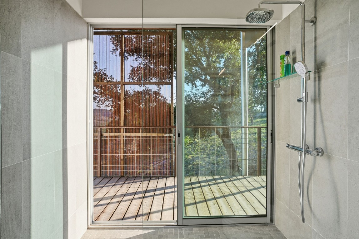 2037 Wolf Creek Ranch Road Burnet, TX 78611 - Photo 33 of 40 a view of a bathroom with a glass door