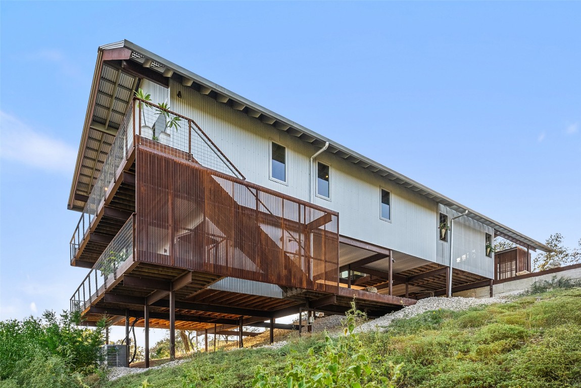 2037 Wolf Creek Ranch Road Burnet, TX 78611 - Photo 36 of 40 a backyard of a house with table and chairs
