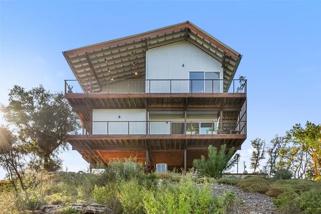an aerial view of mountain with beach