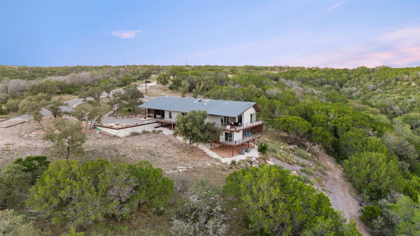 2037 Wolf Creek Ranch Road Burnet, TX 78611 - Photo 40 of 40 an aerial view of residential house with outdoor space and trees all around