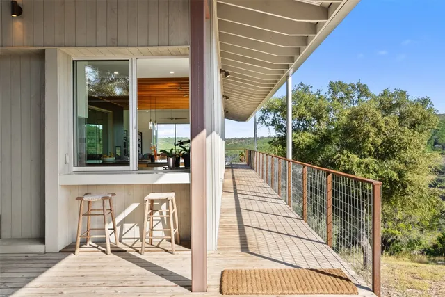 a view of balcony with furniture