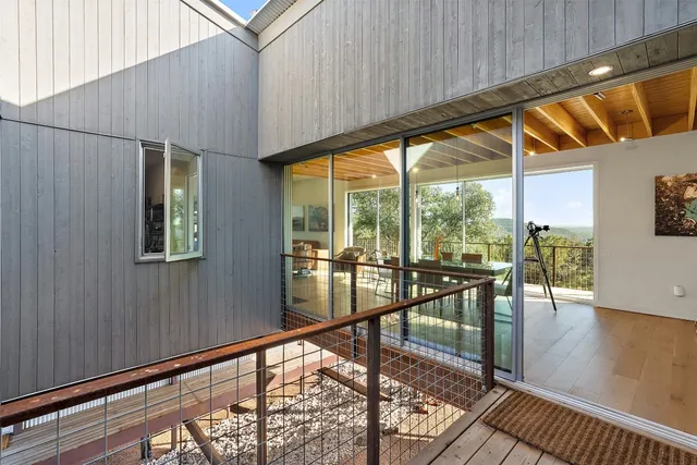 a view of a porch with wooden floor and outdoor space