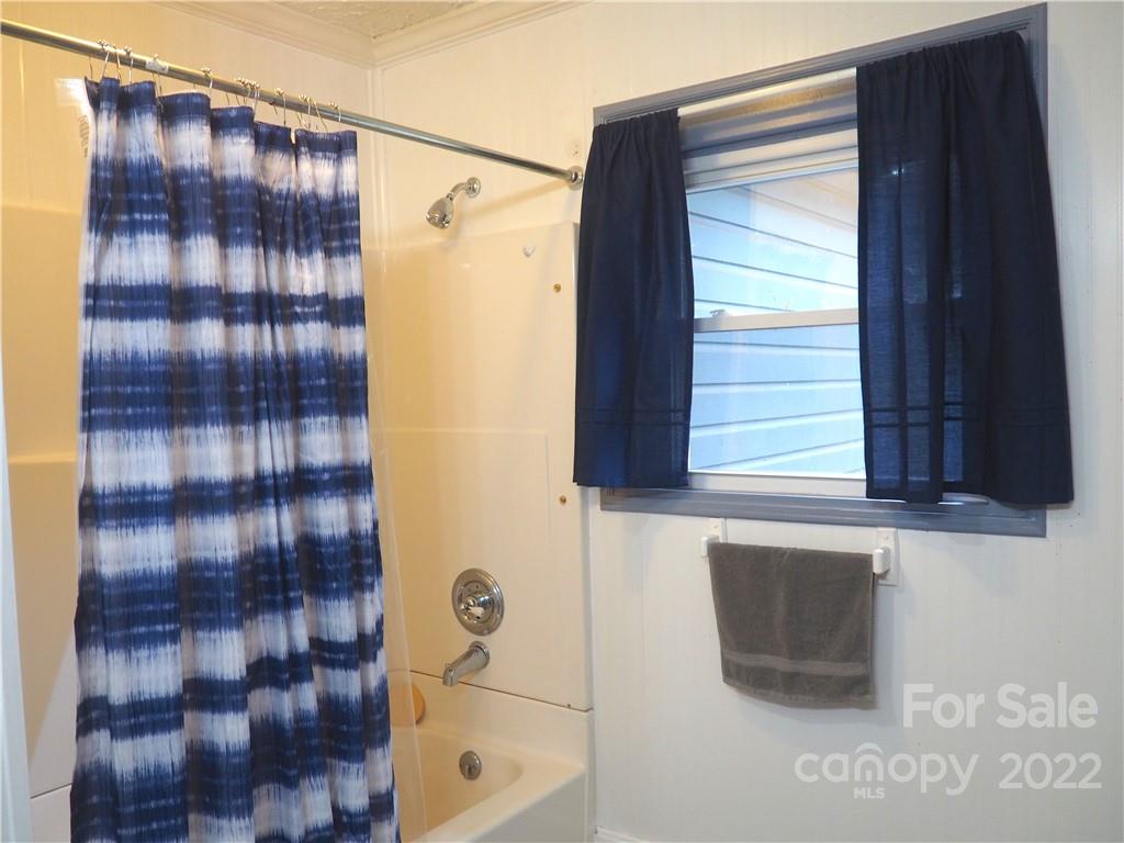 439 North Main Street Rutherfordton, NC 28139 - Photo 17 of 33 a bathroom with a shower and a window