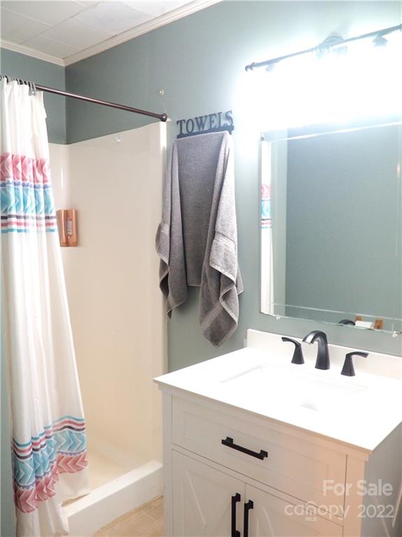 439 North Main Street Rutherfordton, NC 28139 - Photo 21 of 33 a bathroom with a sink and a mirror