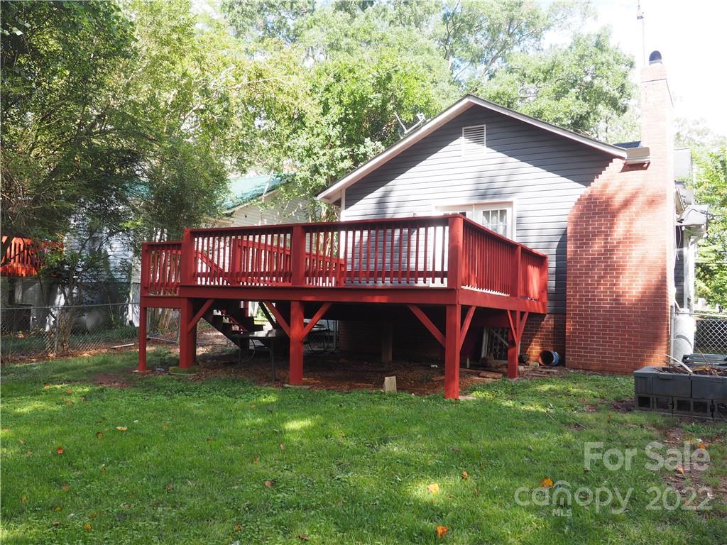 439 North Main Street Rutherfordton, NC 28139 - Photo 25 of 33 a view of backyard of house with wooden deck and seating space