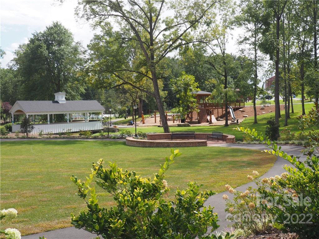 439 North Main Street Rutherfordton, NC 28139 - Photo 31 of 33 a view of a swimming pool with lawn chairs under an umbrella
