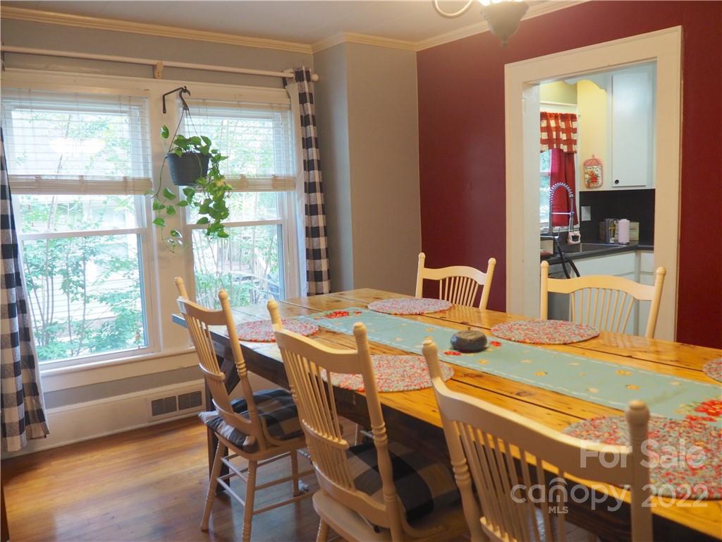 439 North Main Street Rutherfordton, NC 28139 - Photo 6 of 33 a dining room with furniture a chandelier and wooden floor