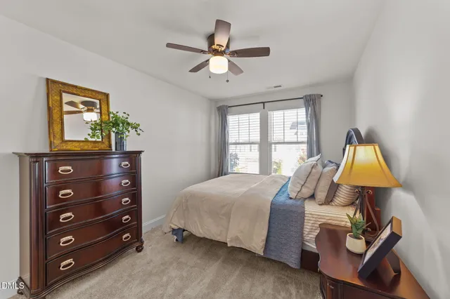 a bed room with a bed and a window