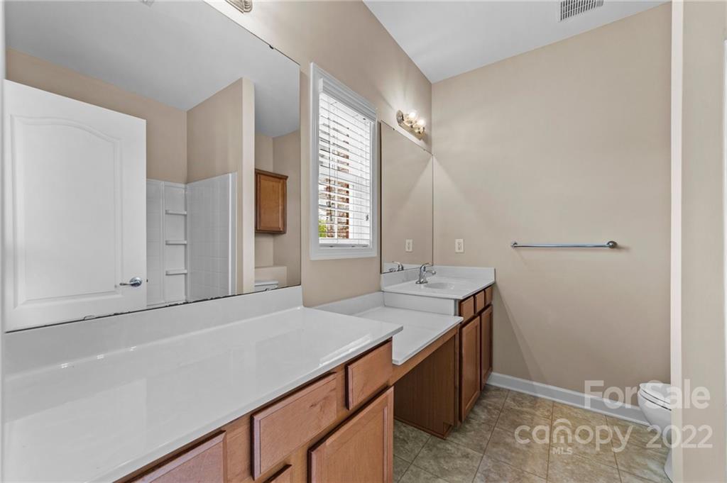 10559 Rocky Ford Club Road Charlotte, NC 28078 - Photo 11 of 18 a bathroom with a sink and a mirror