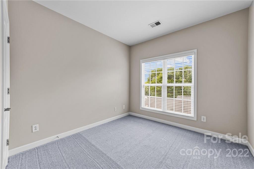 10559 Rocky Ford Club Road Charlotte, NC 28078 - Photo 13 of 18 an empty room with a window
