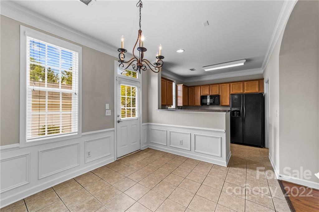 10559 Rocky Ford Club Road Charlotte, NC 28078 - Photo 5 of 18 a large kitchen with kitchen island granite countertop a stove a sink and a refrigerator