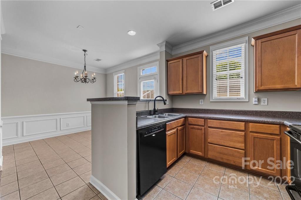 10559 Rocky Ford Club Road Charlotte, NC 28078 - Photo 8 of 18 a kitchen with stainless steel appliances granite countertop a sink and cabinets