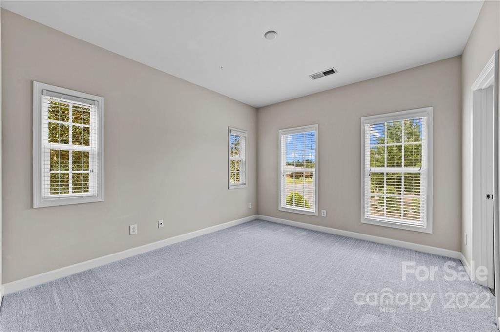 10559 Rocky Ford Club Road Charlotte, NC 28078 - Photo 10 of 18 a view of an empty room with a window