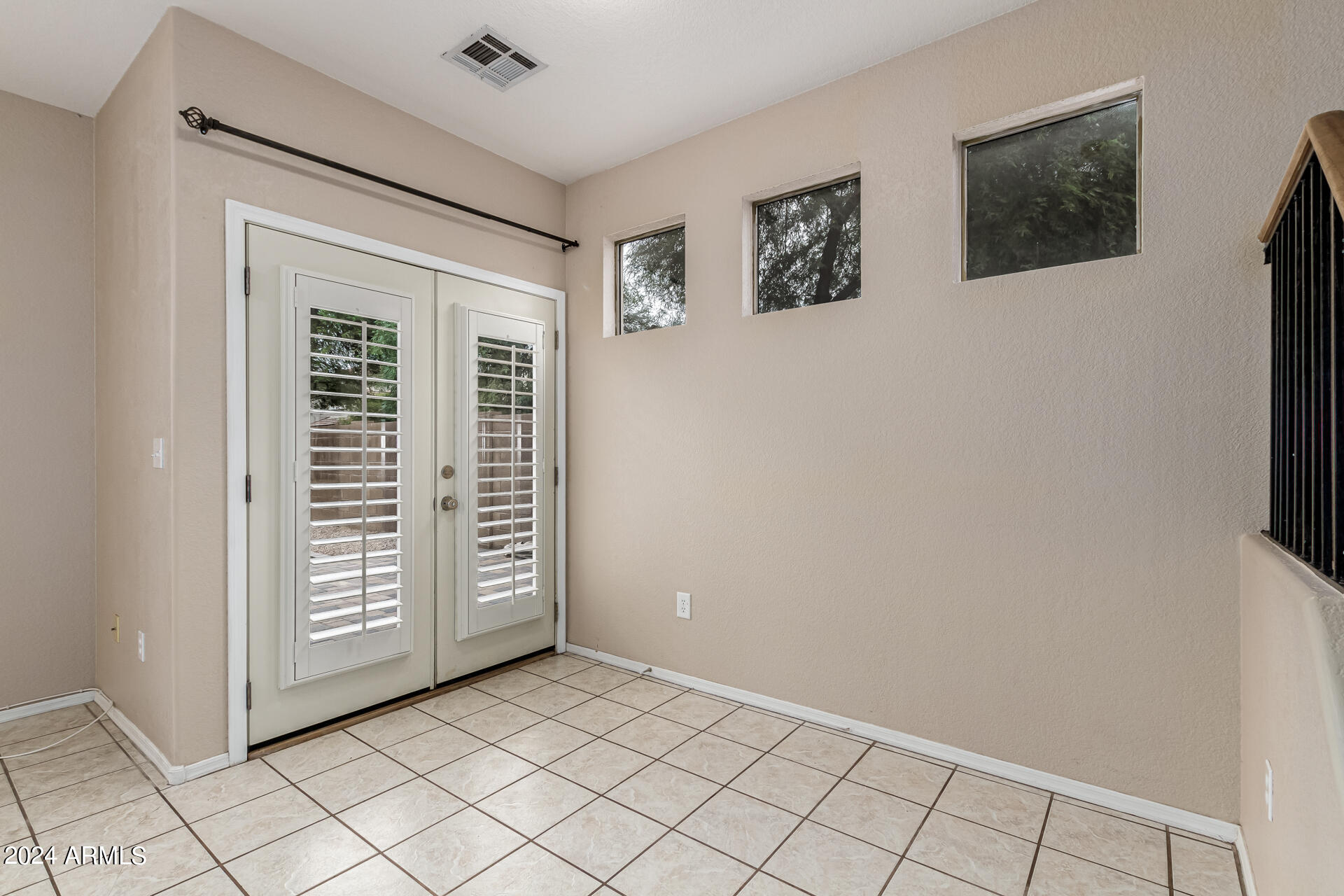 1371 South Boulder Street, Unit A Gilbert, AZ 85296 - Photo 12 of 43 an empty room with windows