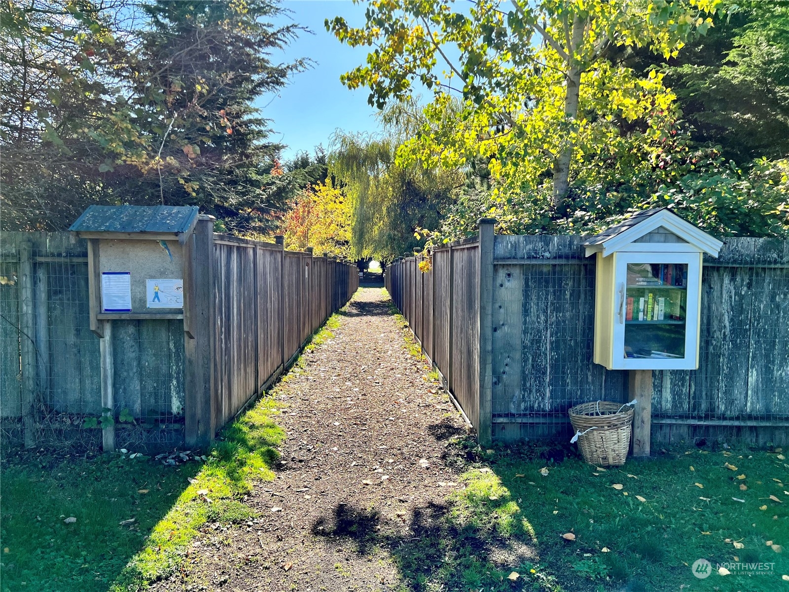 0 Apa-lot 1 Rd Point Point Roberts, WA 98281 - Photo 9 of 12 a view of a backyard with table and chairs and wooden fence