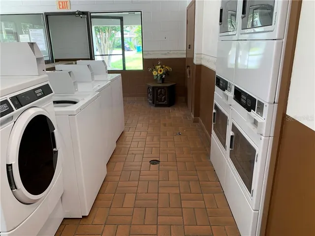 a hallway with washer and dryer