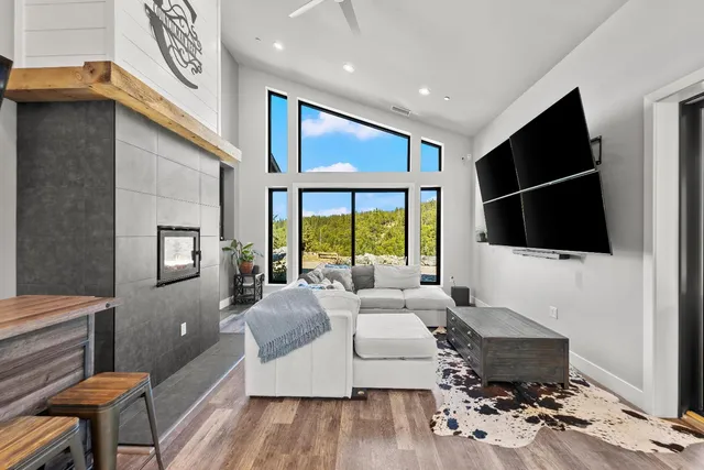 a bathroom with a granite countertop sink a mirror a shower and a bathtub
