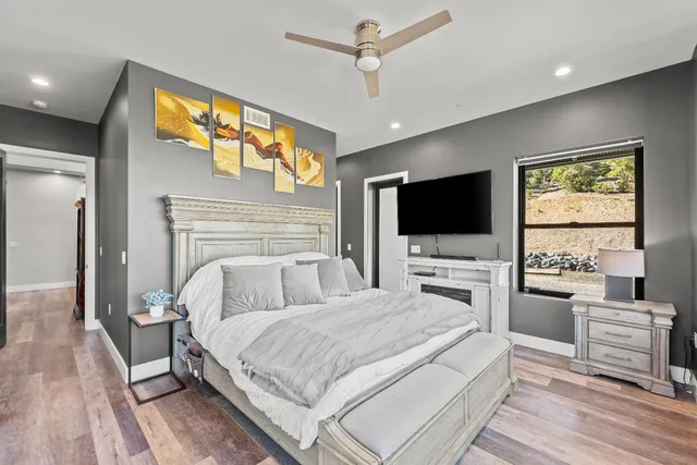 a bathroom with a granite countertop sink a clock and a mirror
