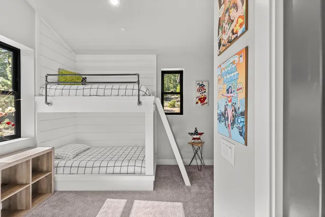 a view of a house with a yard and hanging chair